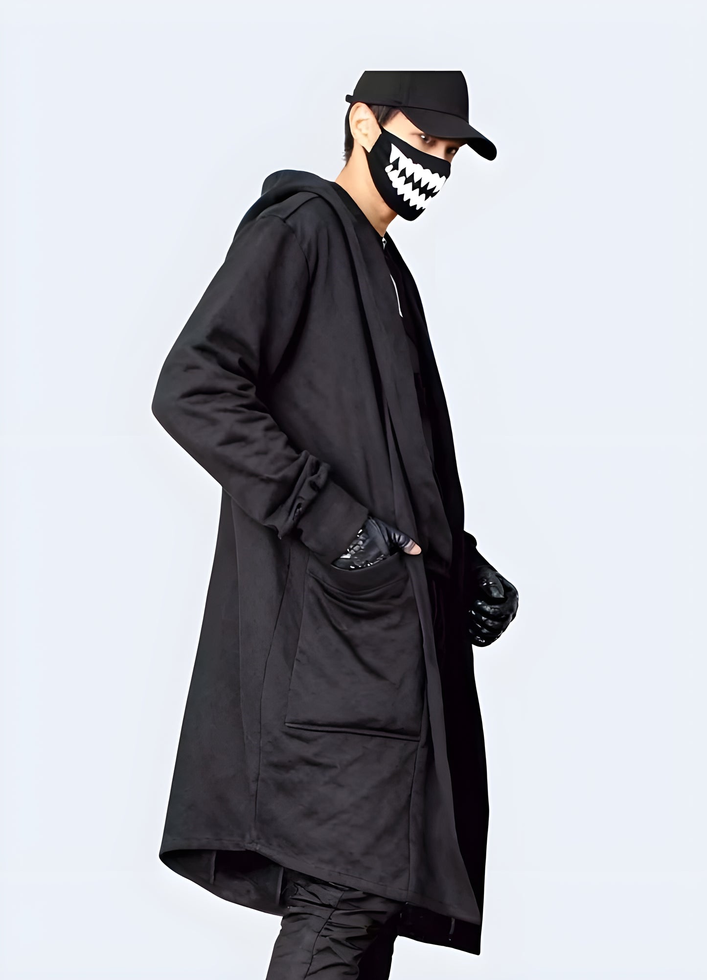 Front view of a man wearing a streetwear cloak black cross, showcasing its oversized silhouette and eye-catching style for a standout look in the Canada.