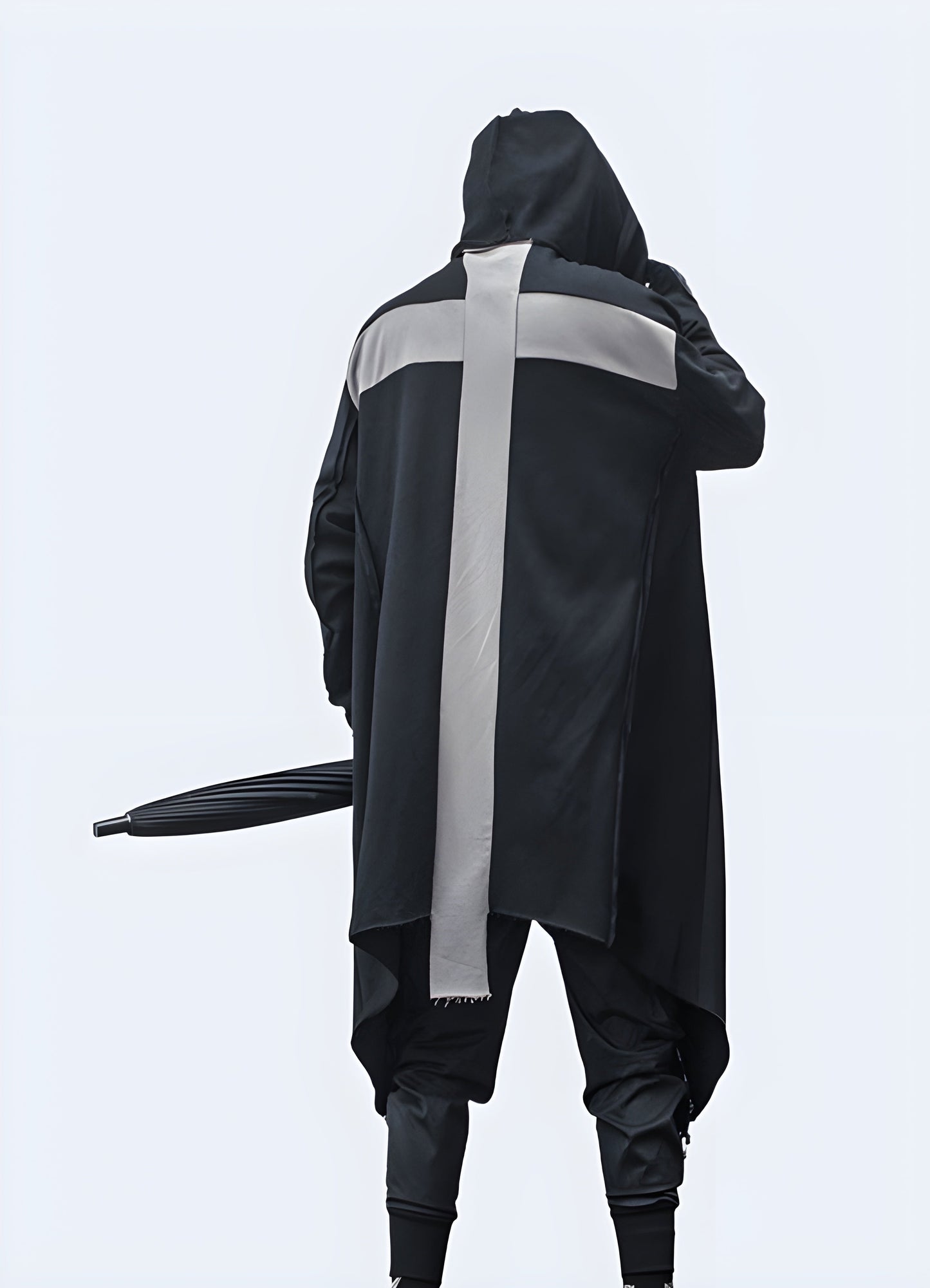 Back view of a man wearing a streetwear cloak with grey cross, showcasing its oversized silhouette and eye-catching style for a standout look in the Canada.