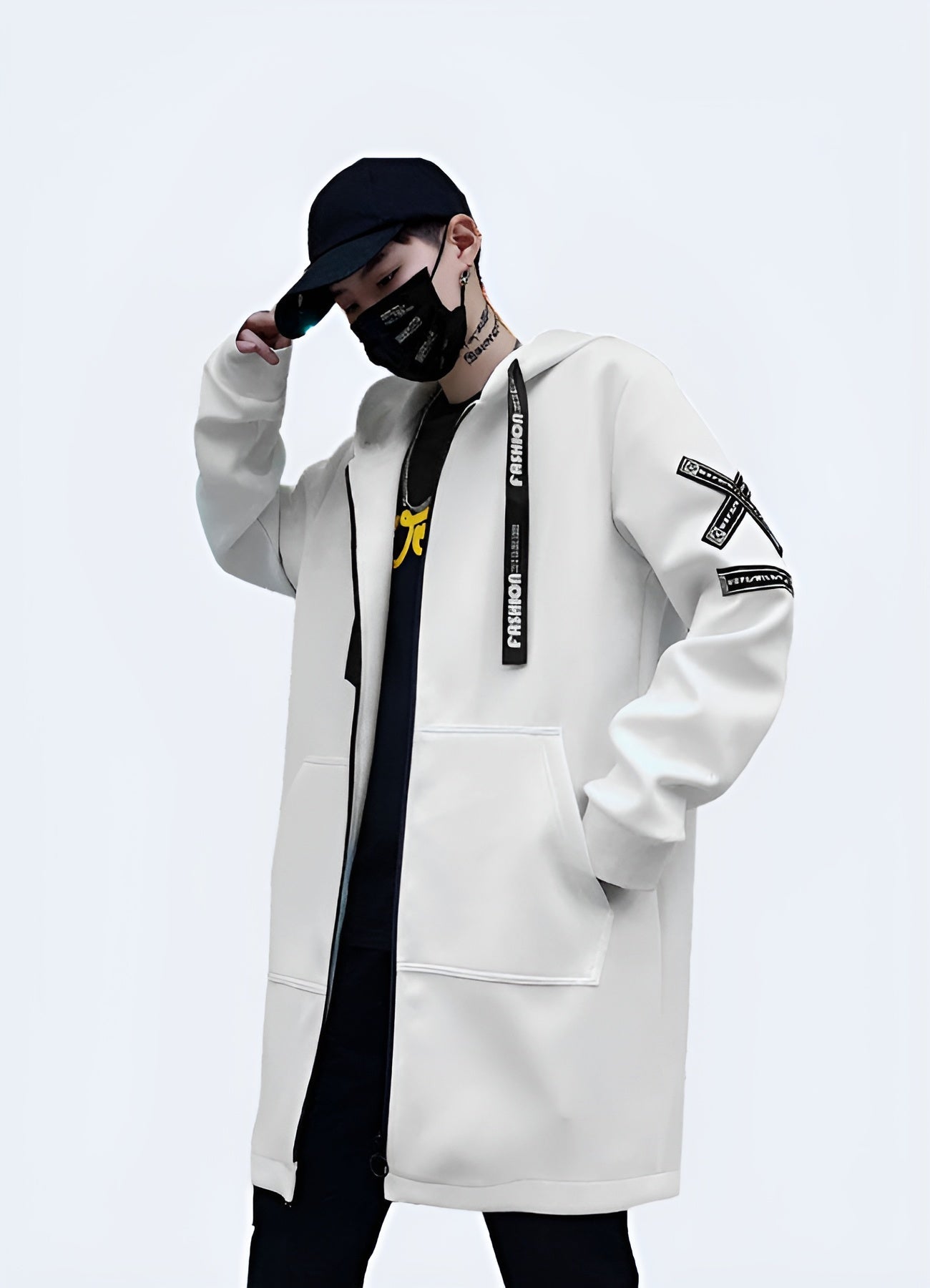 Man wearing a white streetwear coat with a sleek, urban design and functional features, ideal for making a fashionable statement while navigating Canada's city streets in comfort and style.