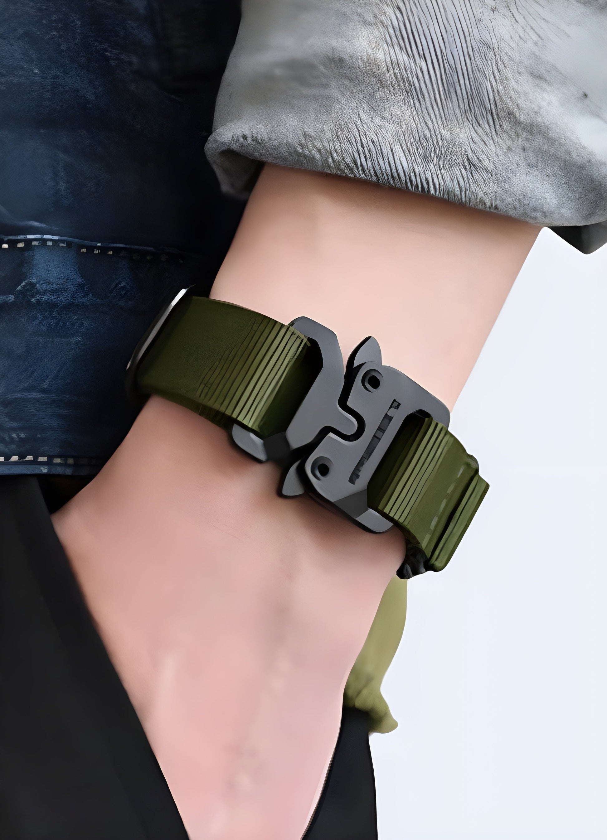 Man wearing a techwear buckle bracelet in green, Canada, demonstrating the bracelet's unique and stylish appearance from the front view.