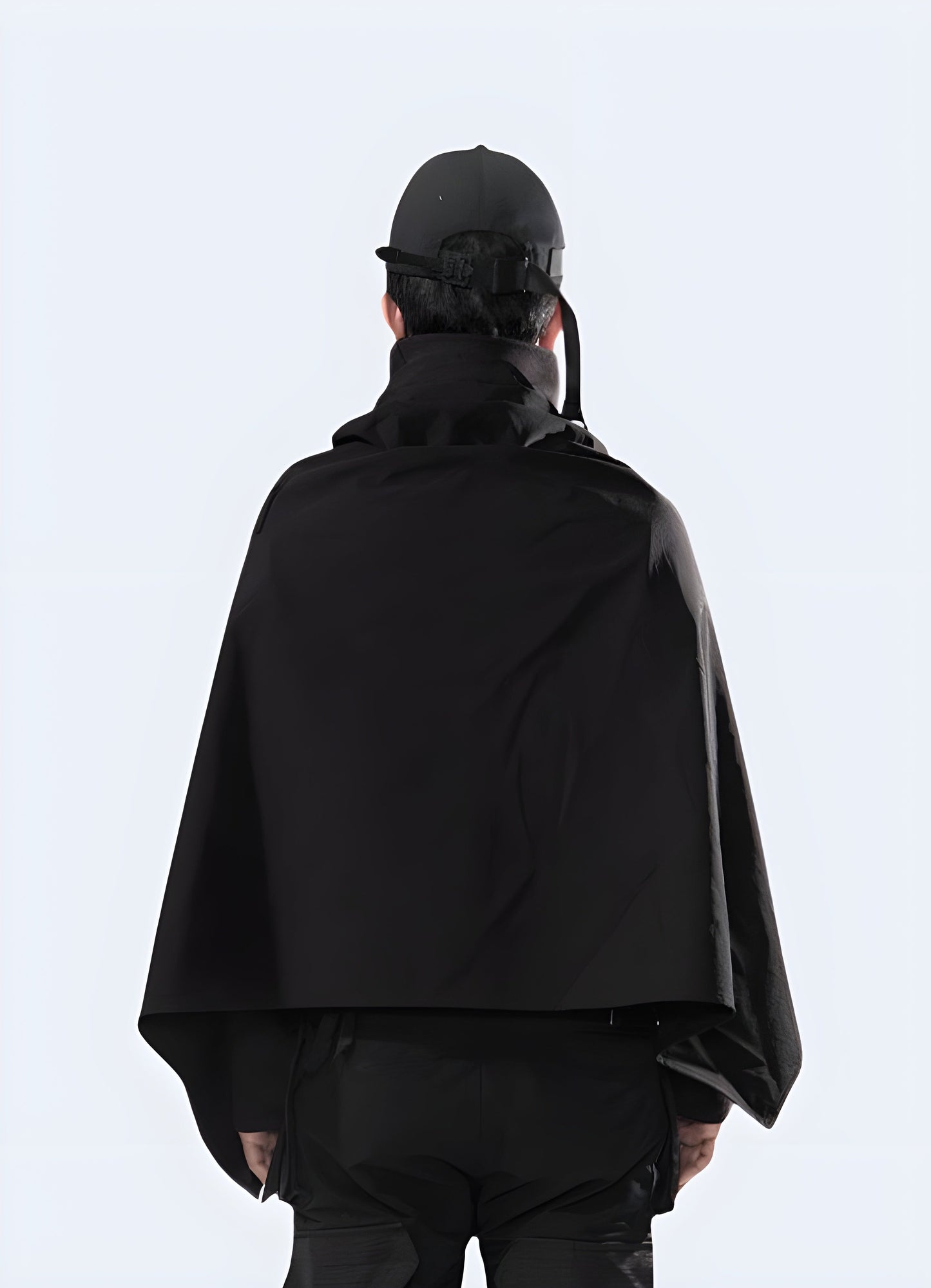 Adjustable straps create customized fit techwear cape.