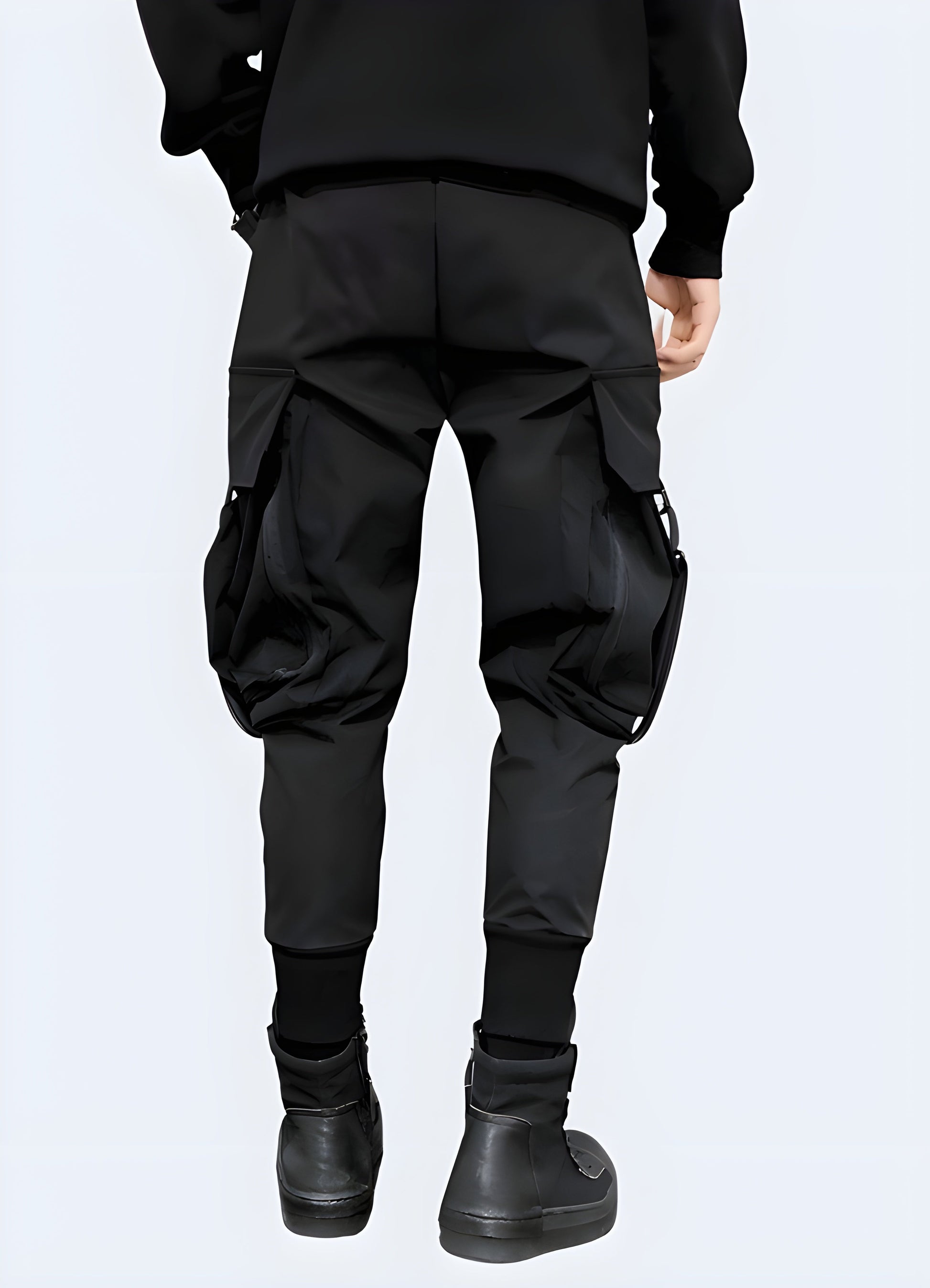 Rear view of man in dark techwear cargo pants with adjustable straps, Canada fashion.