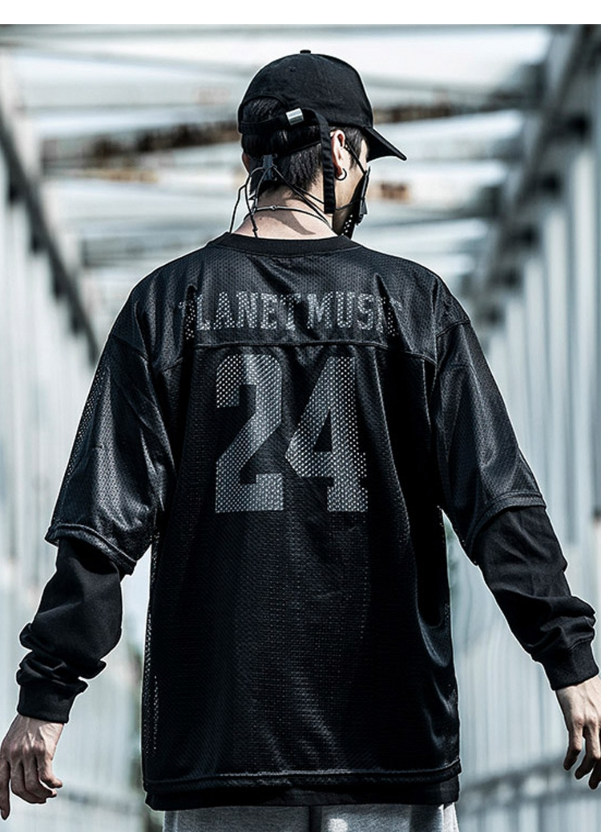 Man wearing techwear jersey, front view, showcasing the sleek design available in Canada. 