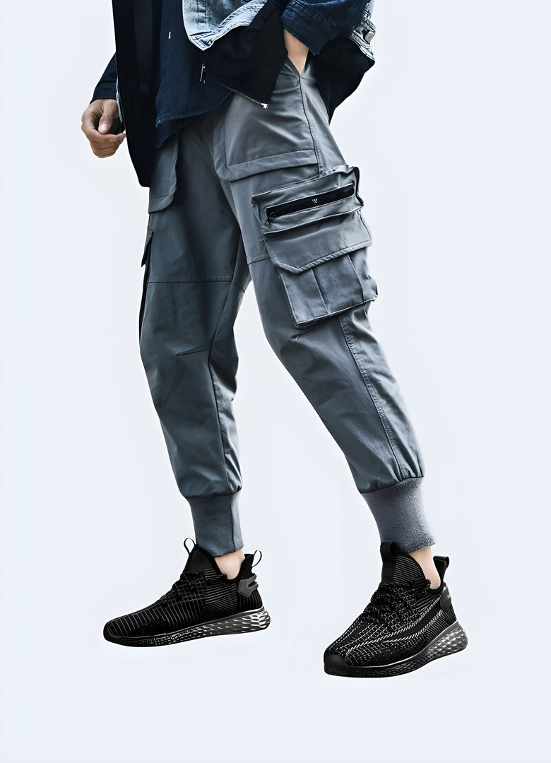 Man sporting techwear running shoes, front side view, displaying the shoe's unique features. Canada-based model shoot.