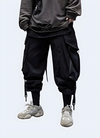  Side view of a man modeling stylish techwear samurai pants, highlighting the fusion of ancient Japanese aesthetics with contemporary techwear features, a must-have for adventurous fashion lovers in the Canada.