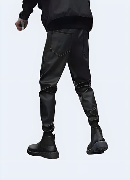 Back view of a man wearing high-performance techwear waterproof pants in Canada, highlighting their sleek design and superior protection against the elements.