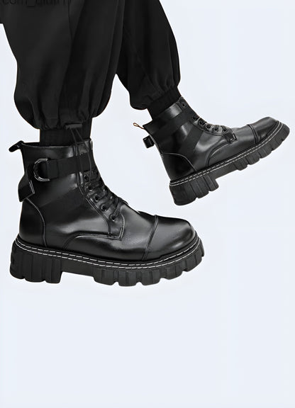 Side view of a man wearing black techwear ankle boots with straps  featuring, demonstrating the comfortable fit, advanced technical features, and eye-catching reflective details ideal for tech-savvy fashion enthusiasts.