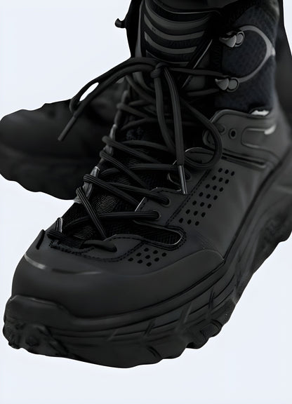 Front and side view of a man wearing techwear snow boots, demonstrating the comfortable fit, advanced performance capabilities, and versatile style perfect for conquering winter landscapes.