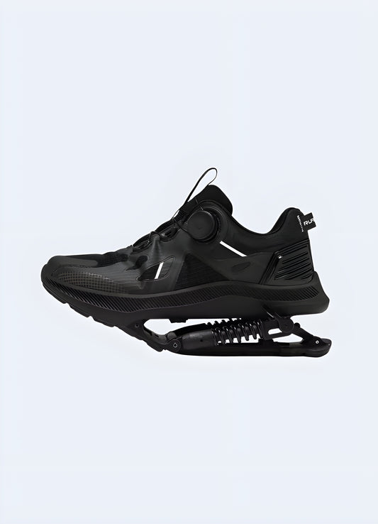 Black mechanical-assisted sneakers, front view, showcasing innovative design and functionality for enhanced performance in the UK.