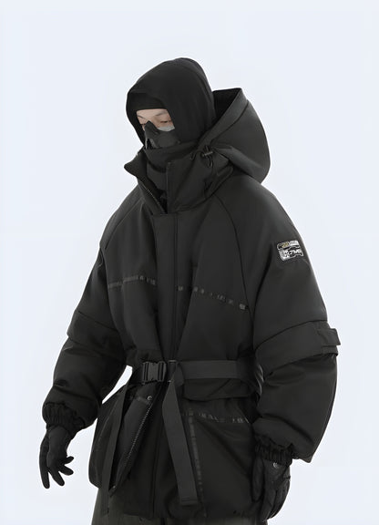 Man wearing a sleek black techwear jacket with a modern, minimalist design and advanced technical features, ideal for facing Canada's diverse weather conditions and urban challenges.