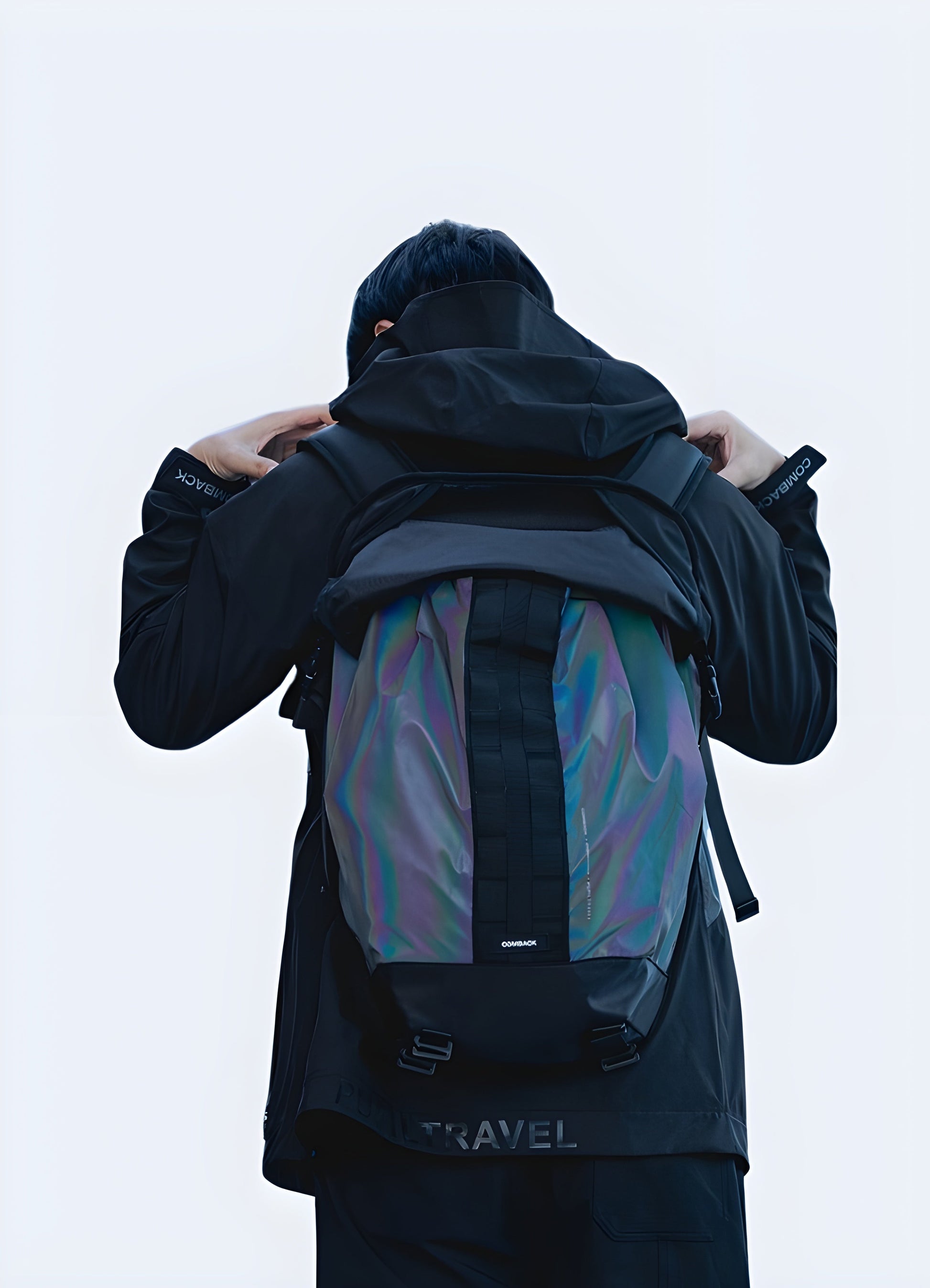 A man wearing a comeback backpack, viewed from the front. The bag features a classic design and is worn across the body or shoulder Canada.