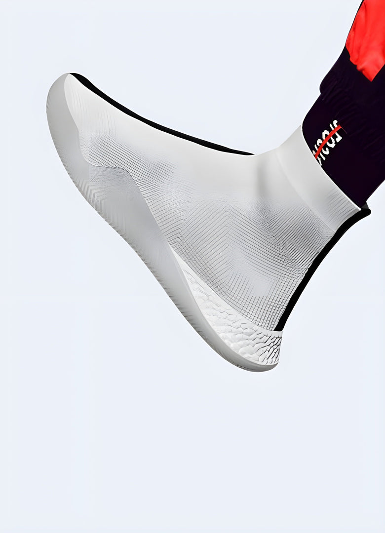 A man wearing no-lace white tech sneakers, showcasing their modern aesthetic and easy slip-on design, ideal for comfortable and stylish everyday wear in the Canada.