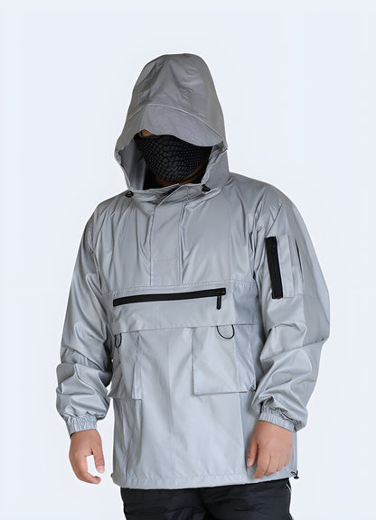 Man wearing a grey reflective streetwear jacket with a sleek, urban design and high-visibility features, perfect for expressing personal style and staying safe while navigating Canada's city streets.