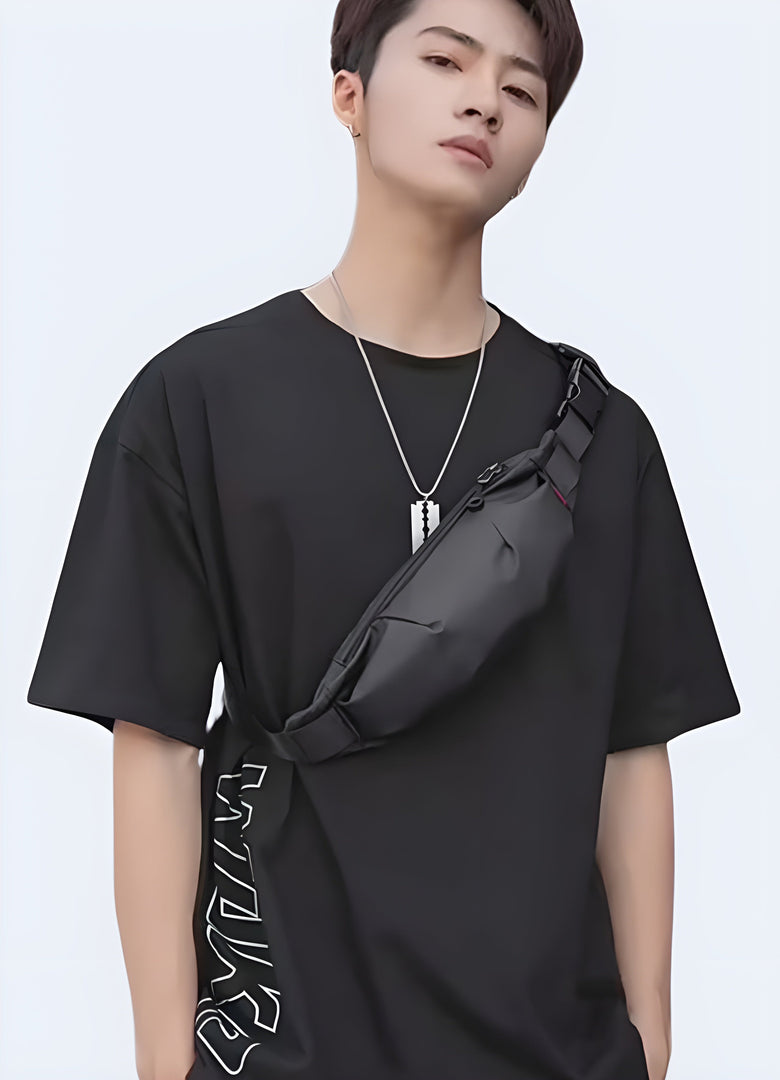The front view highlights the bag’s compact shape and how it fits comfortably across his torso, complementing his outfit with its modern,Canada functional style.