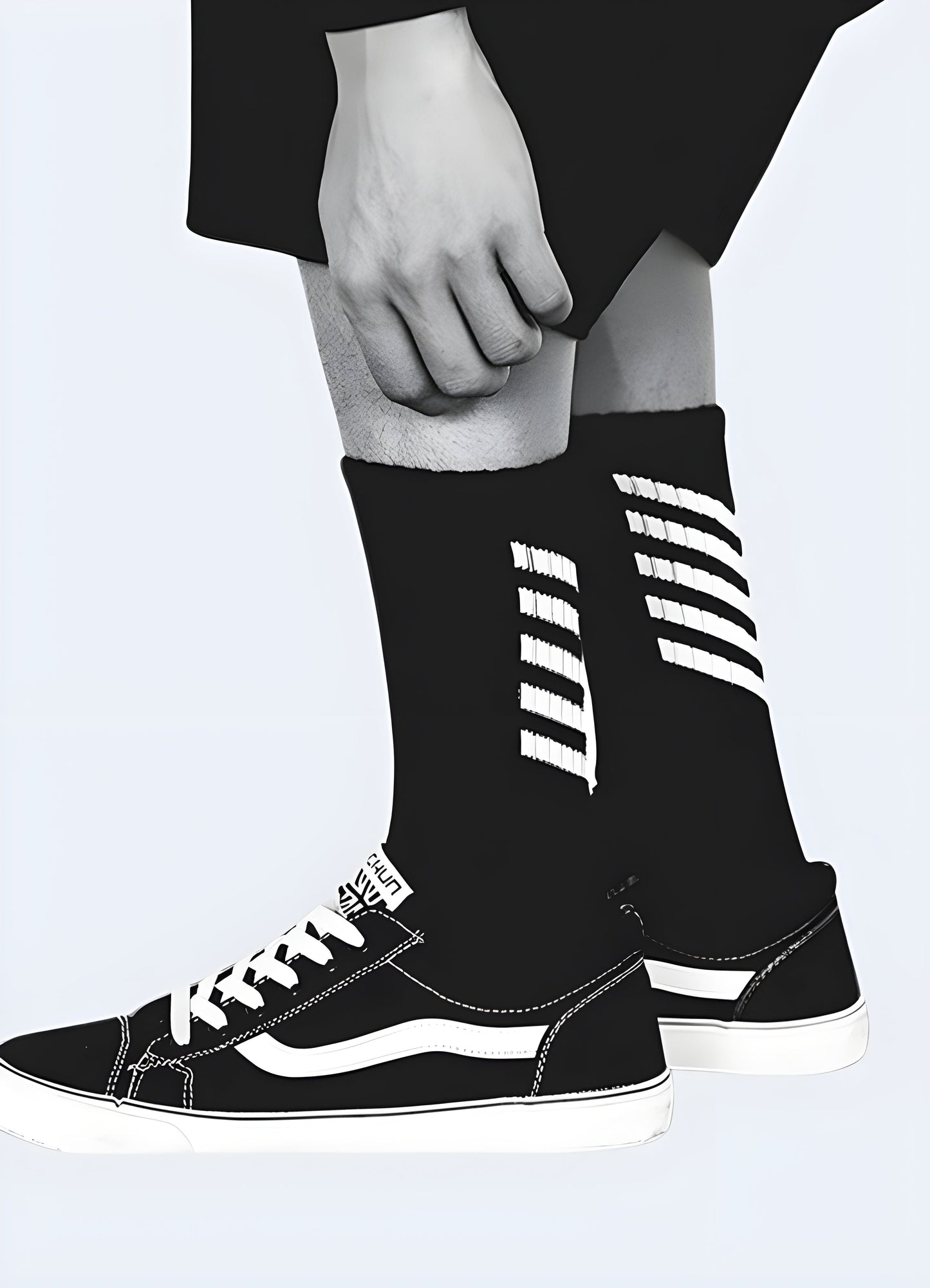 Side view of a man wearing black techwear-inspired streetwear socks, showcasing the sleek and modern style popular in the Canada.