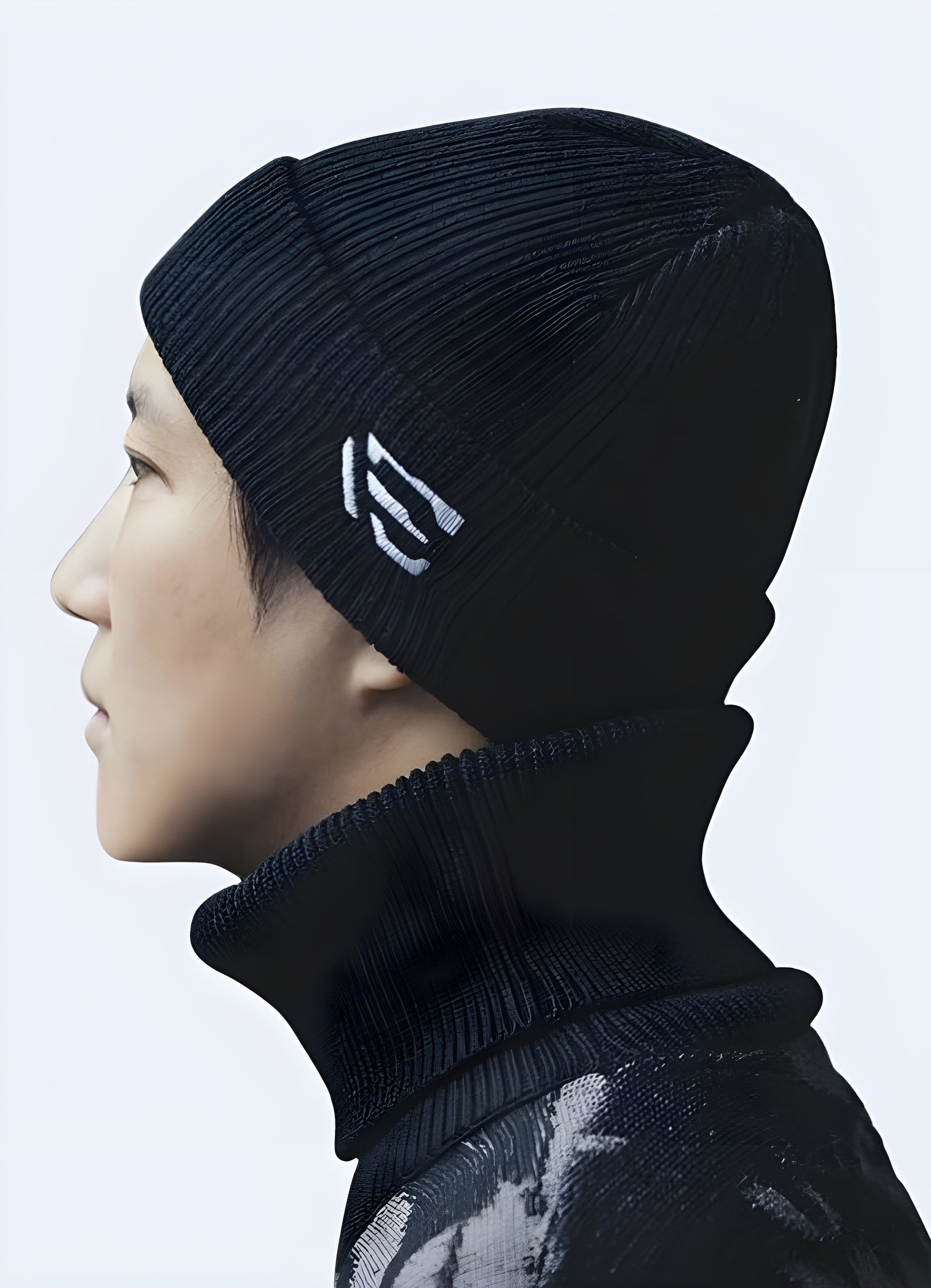 Side view of a man wearing a techwear knit beanie in the Canada, highlighting its modern look and snug fit.