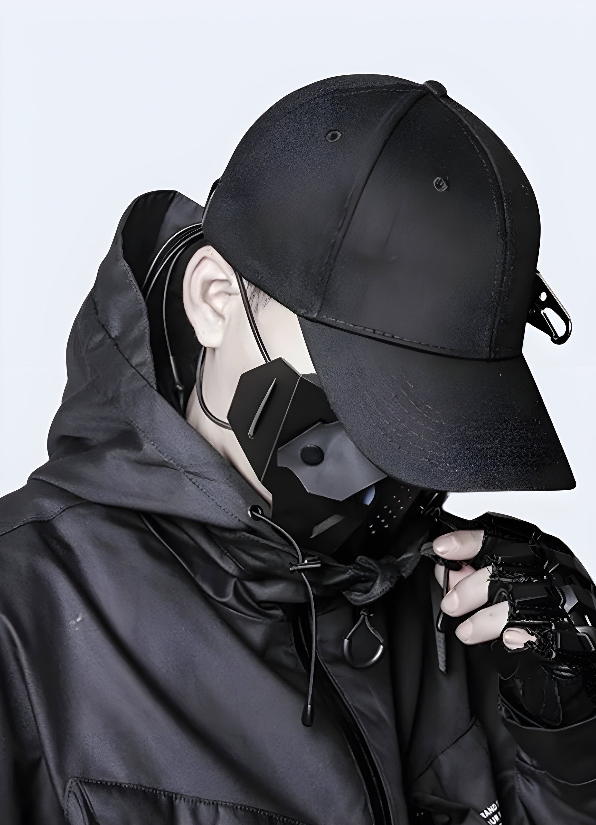 Side view of a man wearing a techwear side buckle cap in the Canada, demonstrating the cap's fit and contemporary appeal.