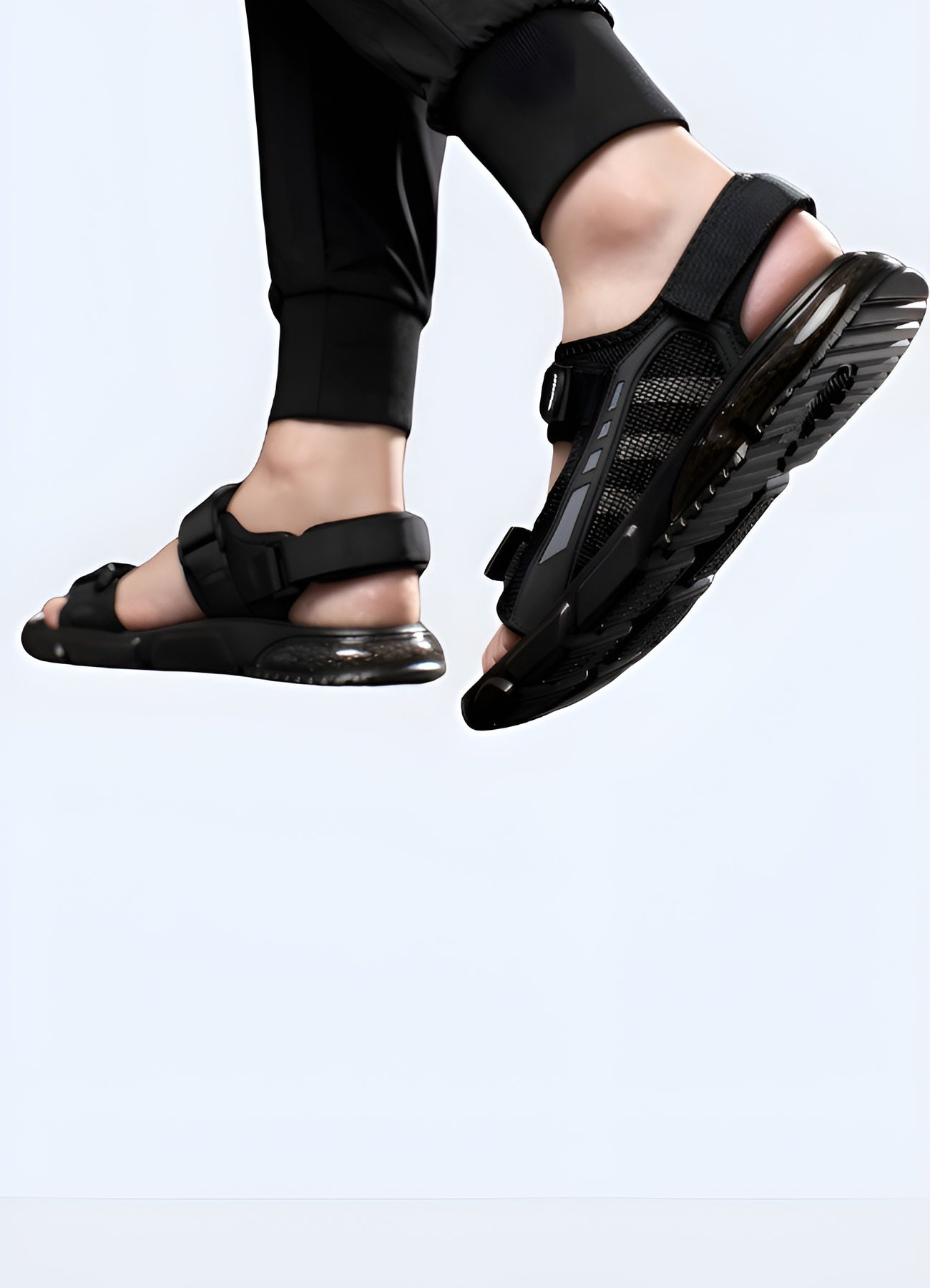 Back and side view of a man sporting techwear slides, highlighting the ergonomic design, advanced cushioning, and avant-garde style suitable for urban fashion enthusiasts.