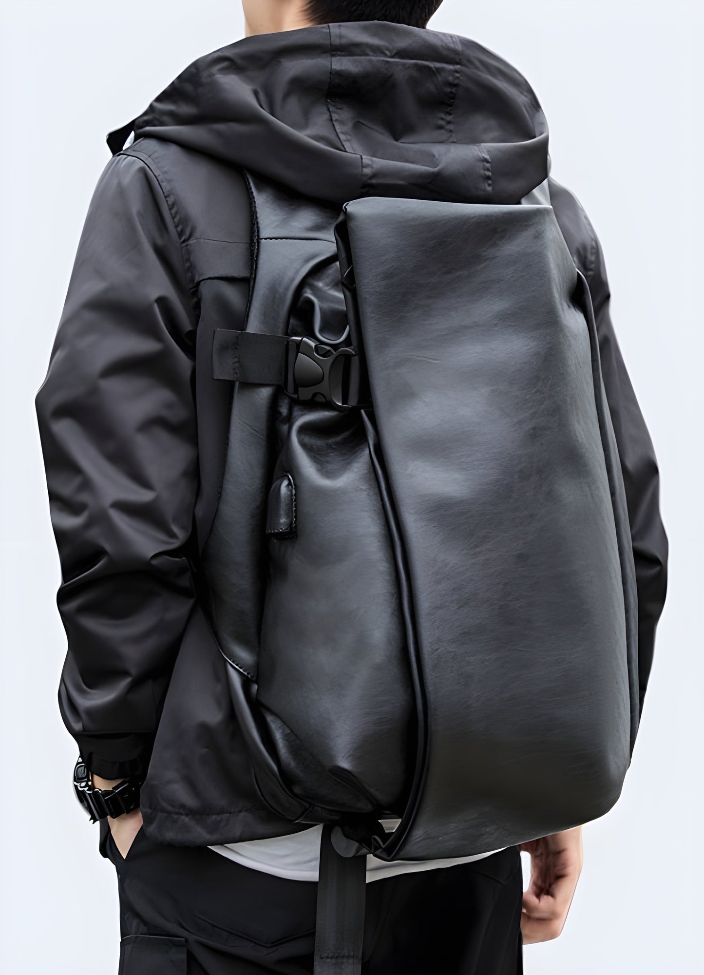 A man wearing an urban leather messenger bag, viewed from the front. The bag features a sleek leather design and is worn across the body with an adjustable strap Canada.