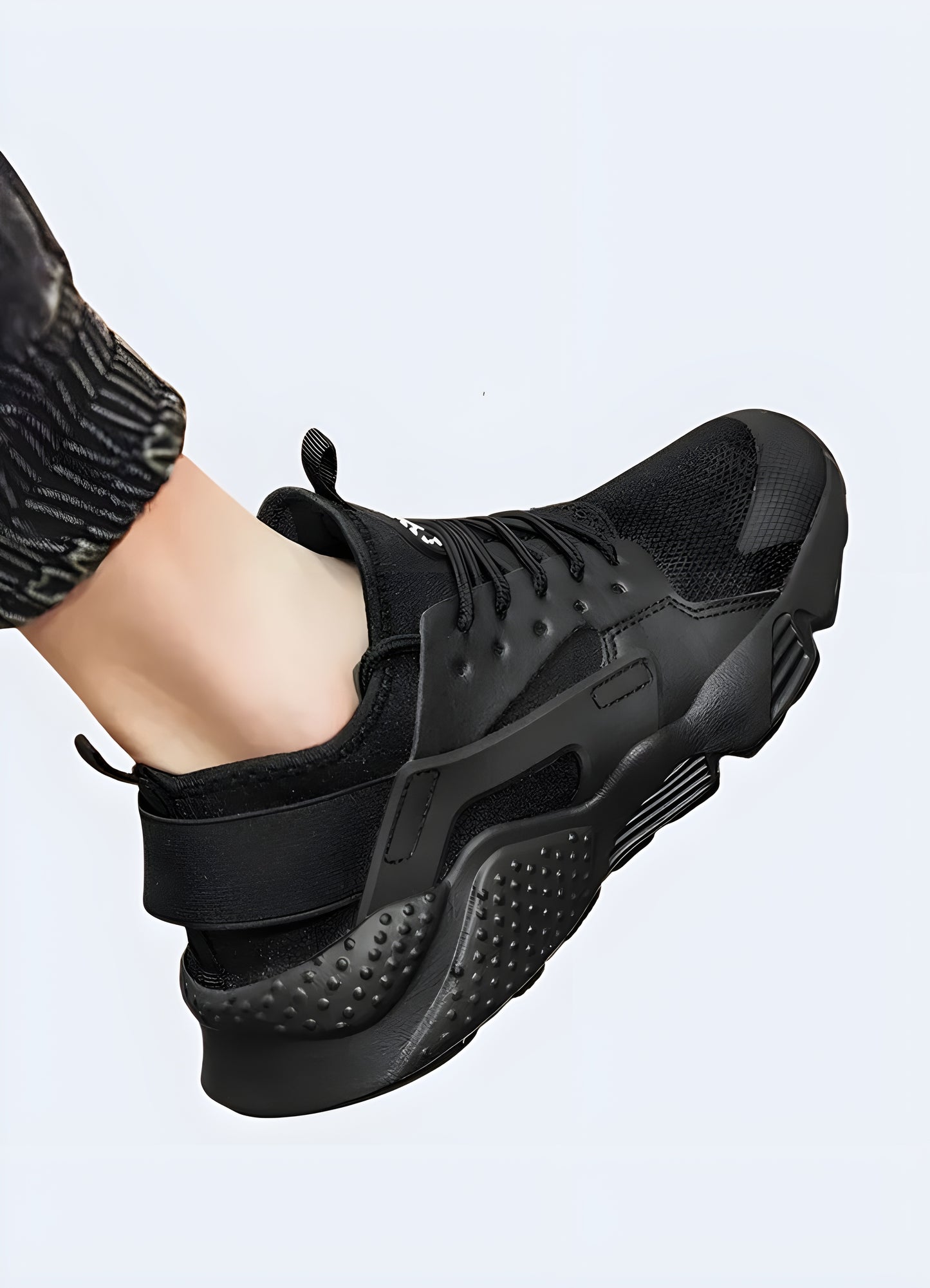 Back and view of black streetwear sneakers showcasing their unique design and materials, ideal for fashion-conscious individuals in the Canada.