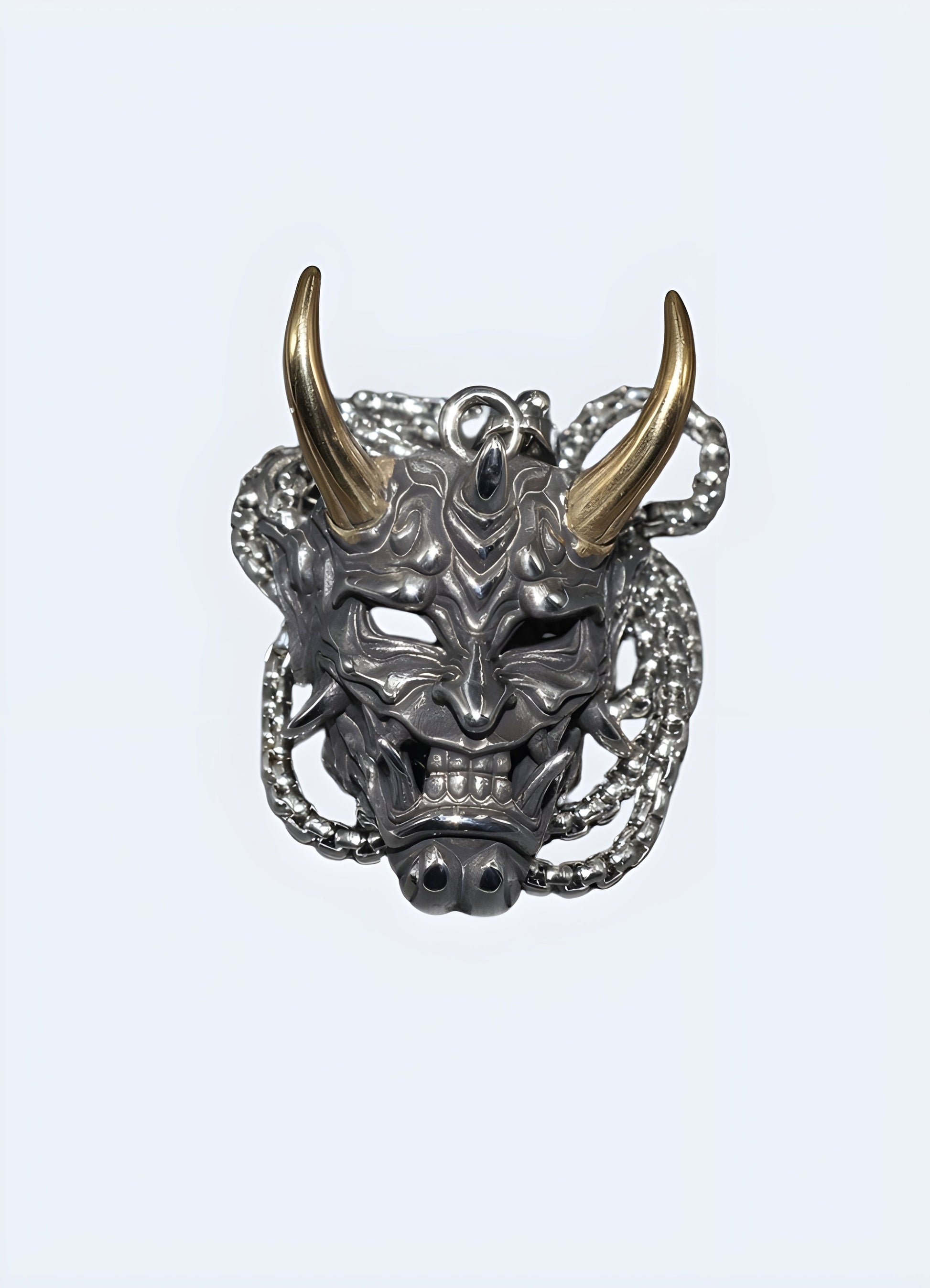 Oni mask necklace in a front view, Canada, featuring a striking and unique design.