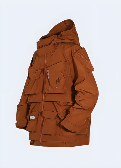 Front view of an eye-catching orange techwear jacket showcasing its modern silhouette, multiple utility pockets, and durable construction, perfect for navigating Canada's urban landscapes in comfort, style, and high visibility.