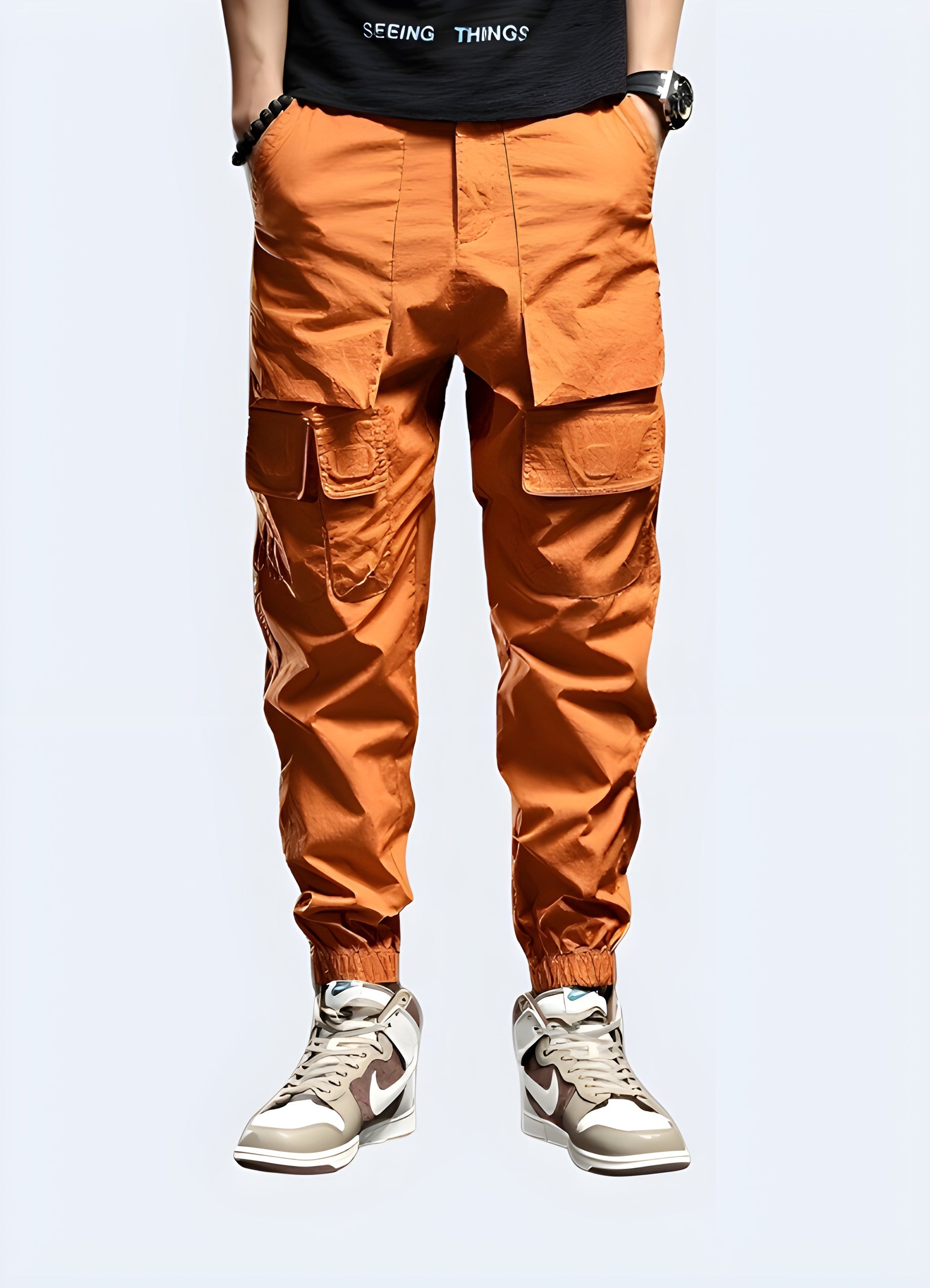 Vibrant orange techwear pants featuring advanced materials and functional design, ideal for making a bold statement while staying comfortable in Canadian urban environments.