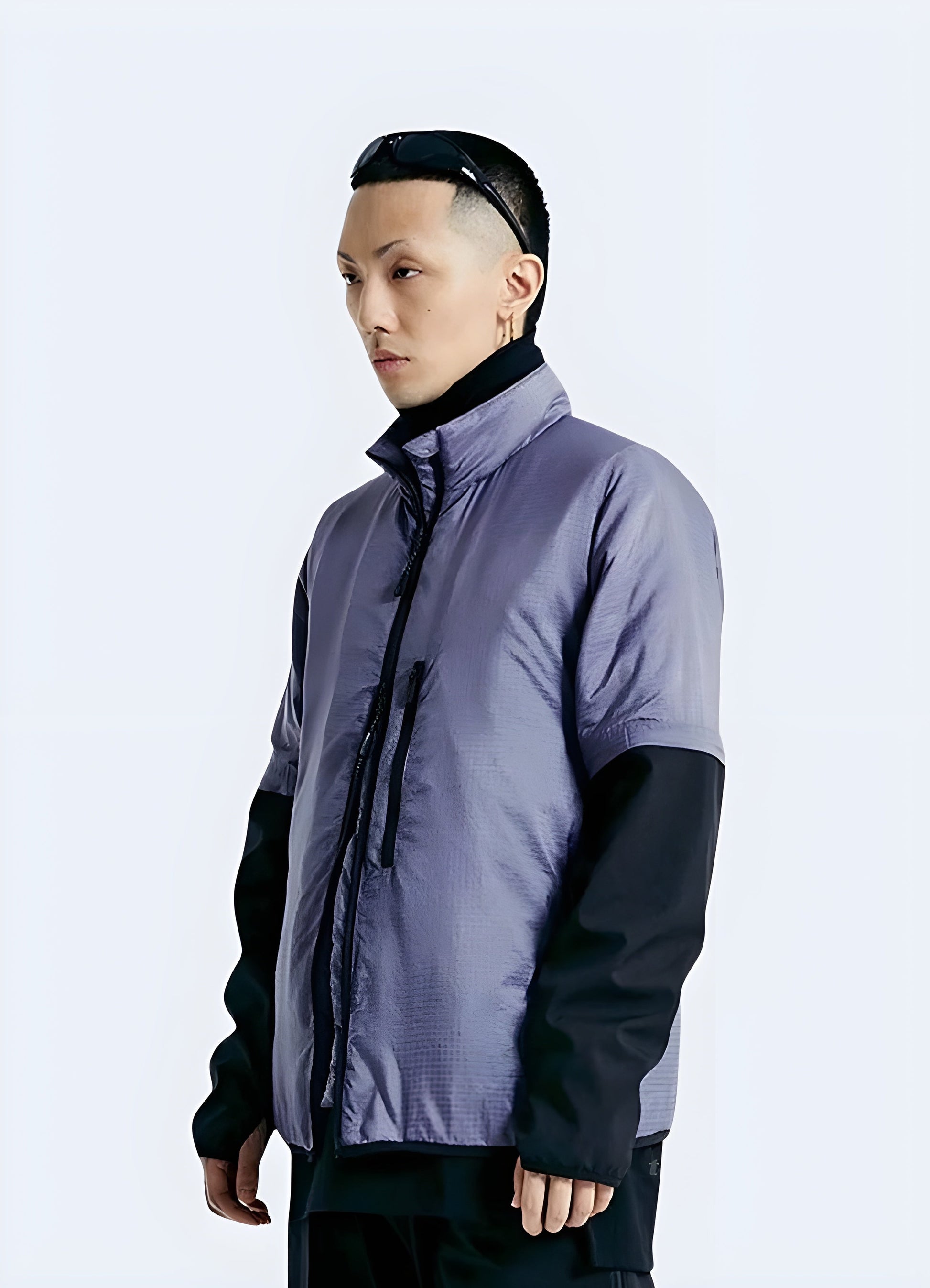 Unique purple techwear jacket with advanced materials and functional design elements, perfect for making a bold statement while navigating Canada's urban landscapes in comfort and style.