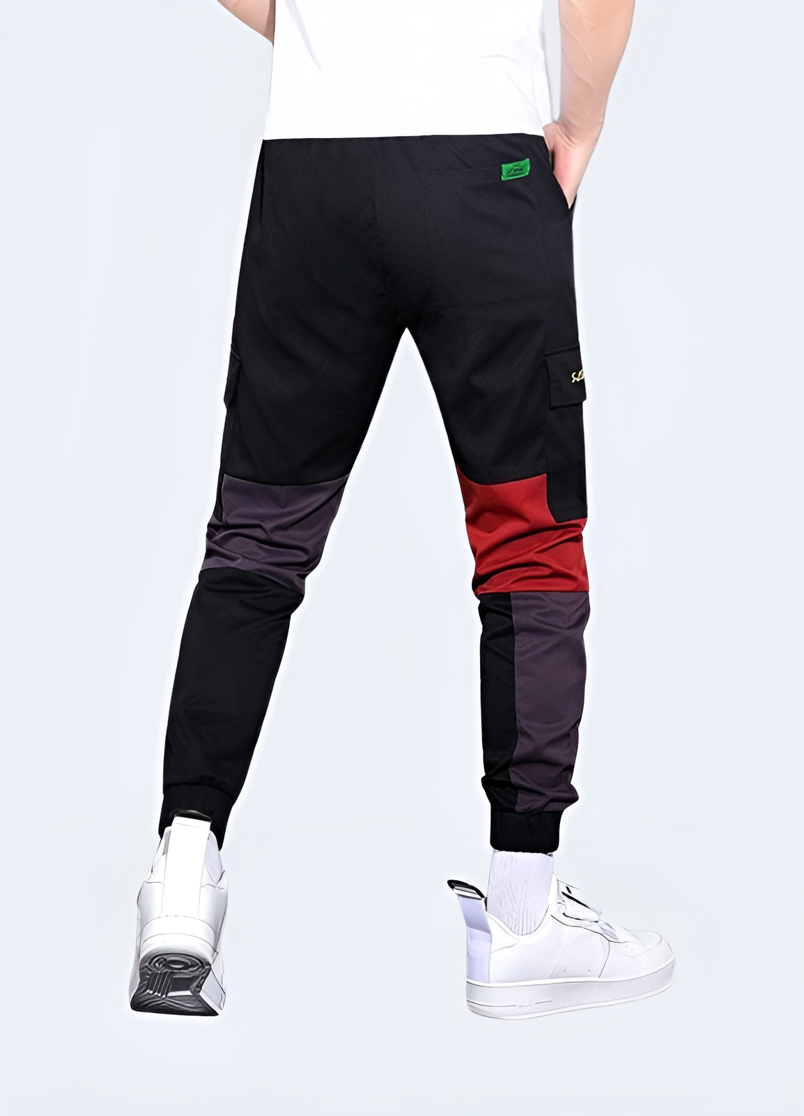 Vibrant red techwear pants featuring advanced materials and functional design, ideal for making a bold statement while staying comfortable in Canadian urban environments.