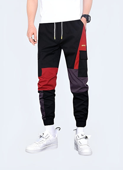 Vibrant red techwear pants featuring advanced materials and functional design, ideal for making a bold statement while staying comfortable in Canadian urban environments.