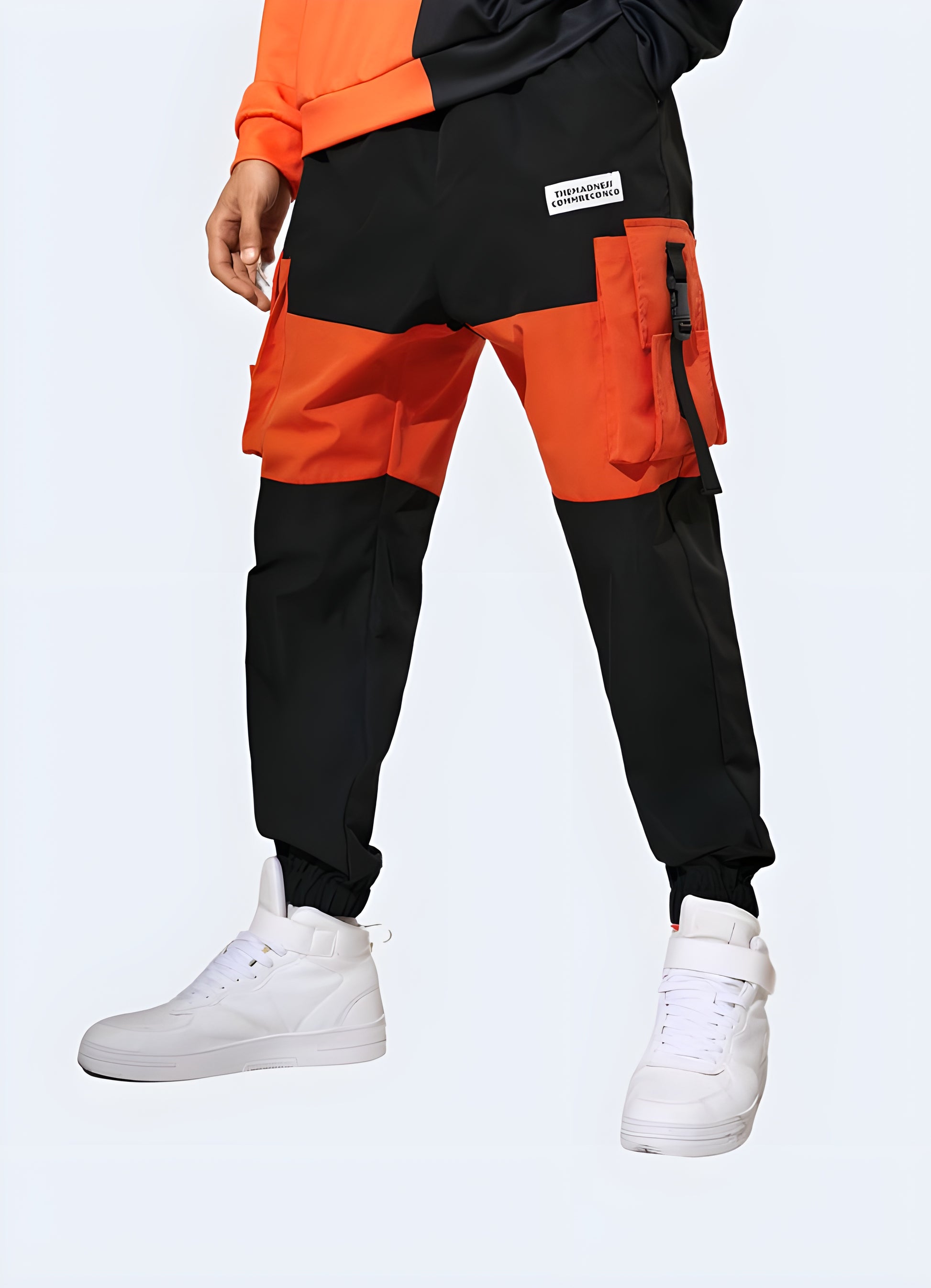 Vibrant red techwear pants featuring advanced materials and functional design, ideal for making a bold statement while staying comfortable in Canadian urban environments.