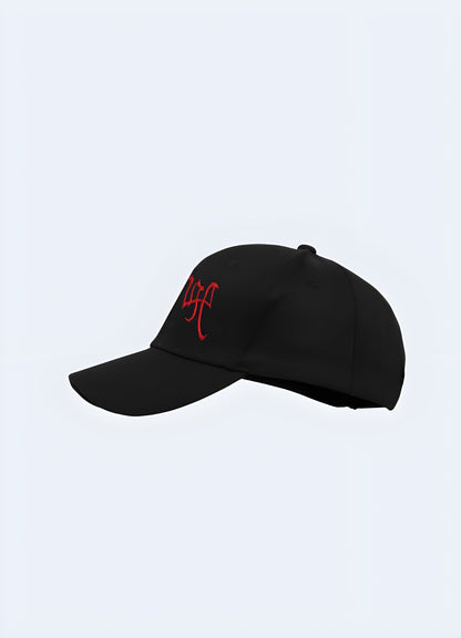 A black "Revenge" hat from a front-side angle, featuring bold lettering on the front for an edgy, minimalist look Canada.