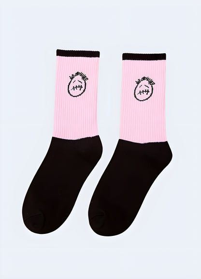 Pink sad face socks presented from the side view, offering a cute and whimsical addition to any outfit, perfect for Canada individuals seeking a touch of humor in their style.