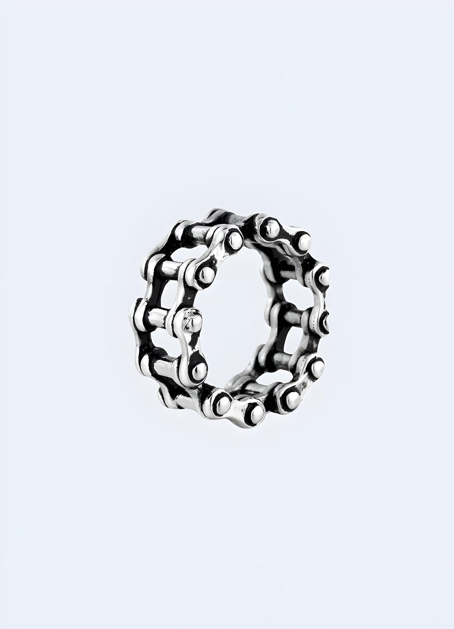 A close-up front-side view of a silver chain ring, showcasing its intricate linked chain design Canada.