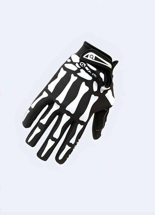 A pair of black tactical gloves featuring a skull design on the back of the hands Canada.