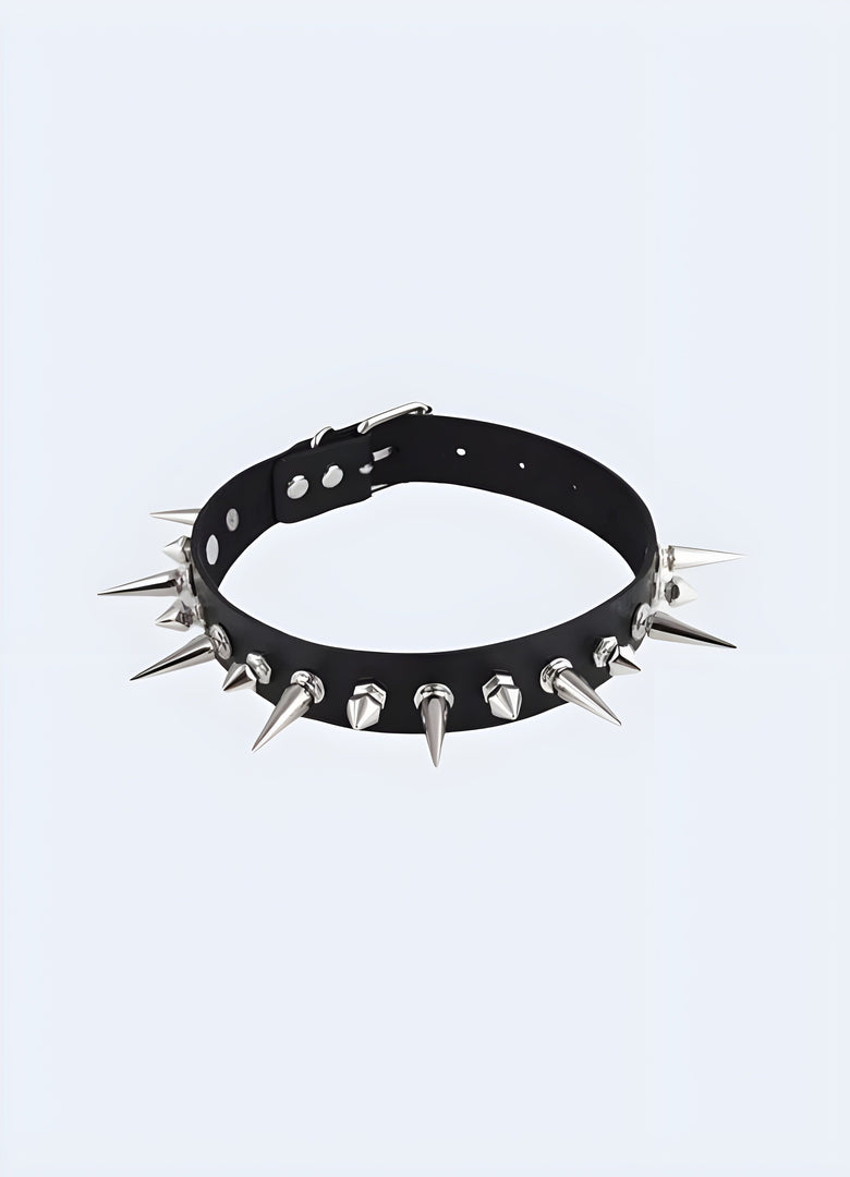 A bold spike choker necklace featuring sharp, evenly spaced spikes, set against a neutral background to highlight its edgy and daring design Canada.