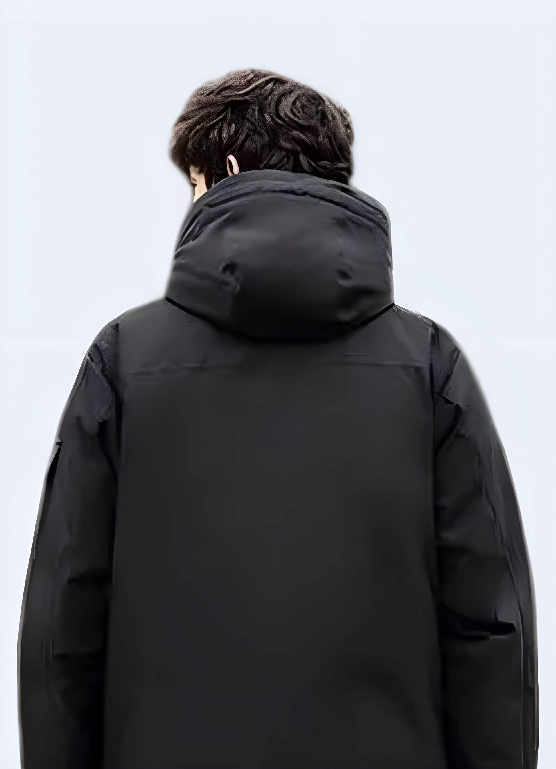 Back view of a fashionable streetwear puffer jacket, showcasing its unique design and insulating properties for cold Canadian weather.