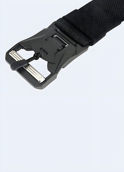 Tactical belt with a clip, front view, worn by a model showcasing its functional design and secure fastening mechanism.