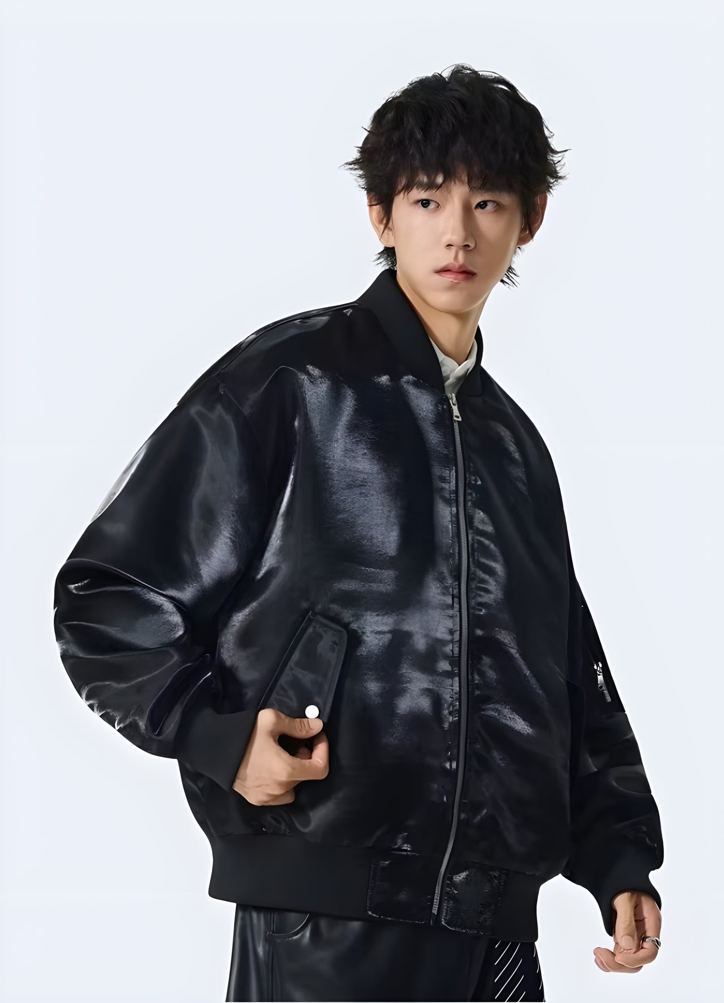 Sleek black tactical shiny leather bomber jacket, perfect for making a bold statement in Canada's urban fashion scene.