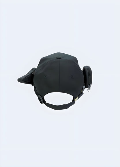 A techwear baseball cap with a functional buckle pocket, shown from the back to highlight the cap’s structure and the innovative design of the pocket Canada.