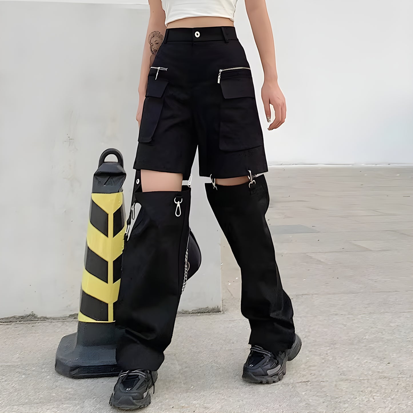 Model view of a woman wearing techwear convertible cargo pants converted to shorts, demonstrating the multi-functional design perfect forCanada weather and outdoor activities.