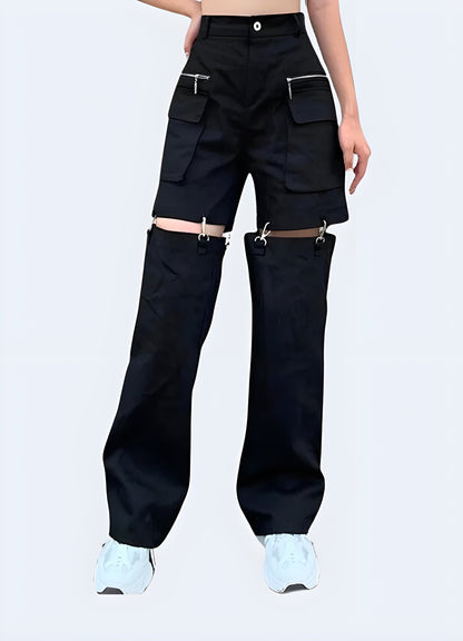  Women's techwear convertible cargo pants in black, featuring detachable legs for versatile wear during urban exploration and outdoor activities.