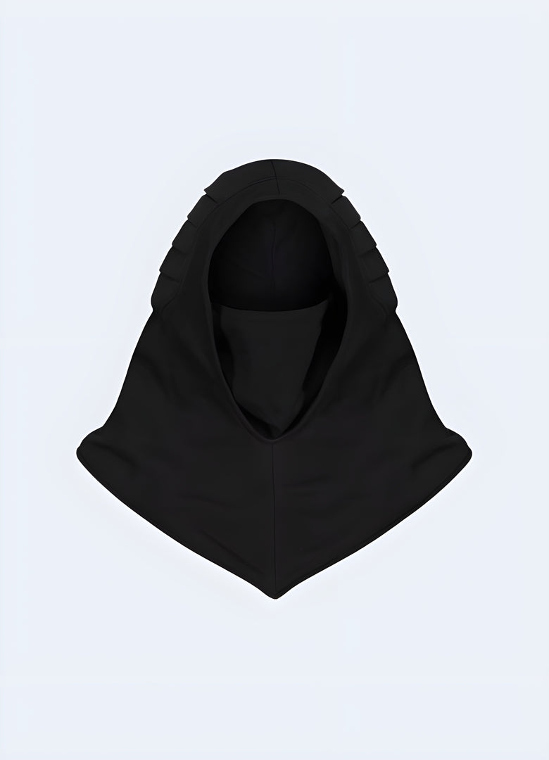 Front view of a person in a black techwear hood featuring multiple adjustable straps and a built-in face mask, ideal for urban exploration or streetwear style.