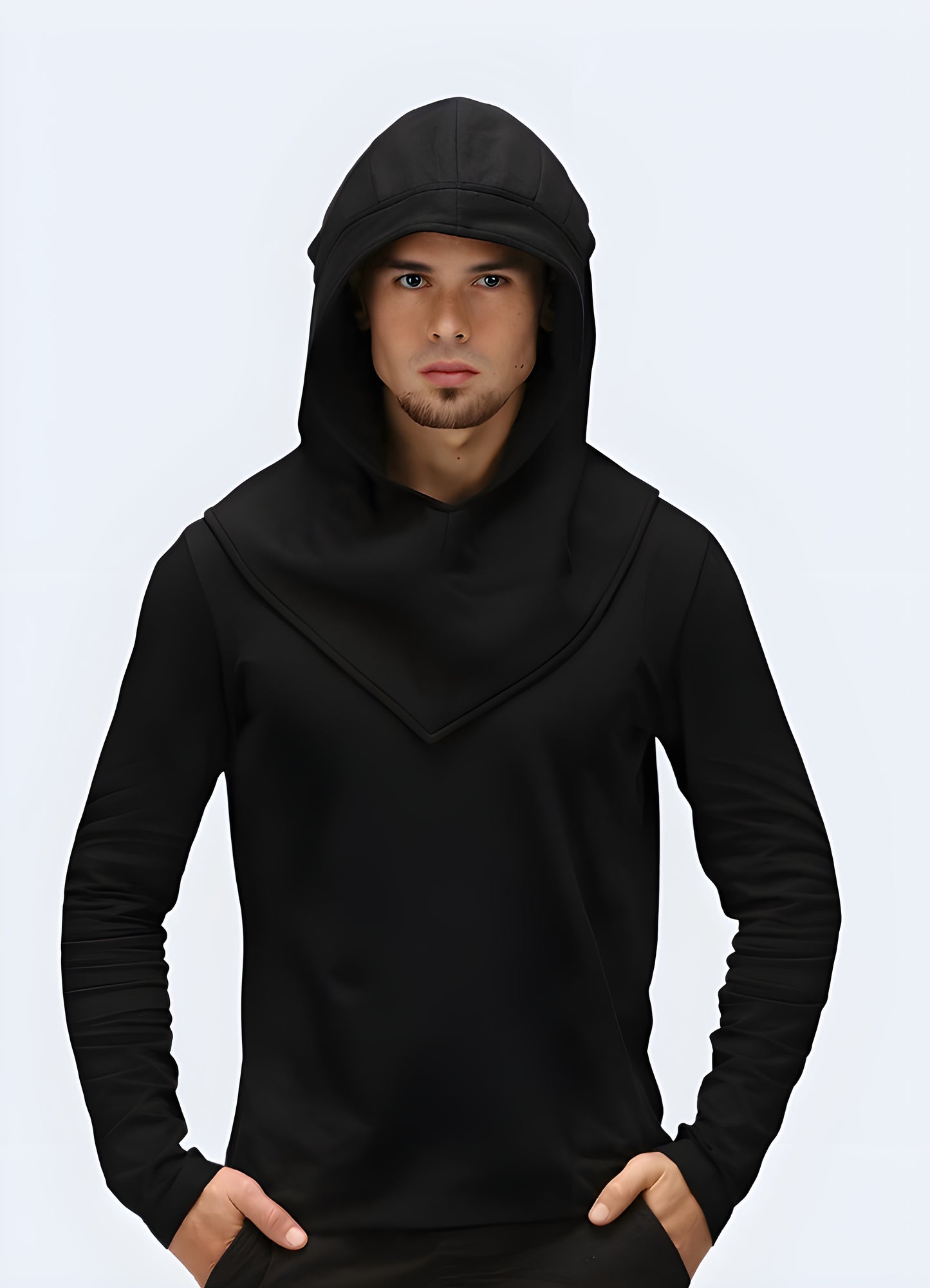 Close-up view of a person wearing a black techwear-style hood with multiple straps and a face mask, suitable for urban exploration or streetwear fashion.