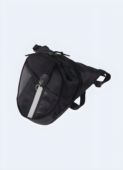 The bag features a sleek, black design with a compact, utilitarian style and adjustable straps for secure wear Canada.