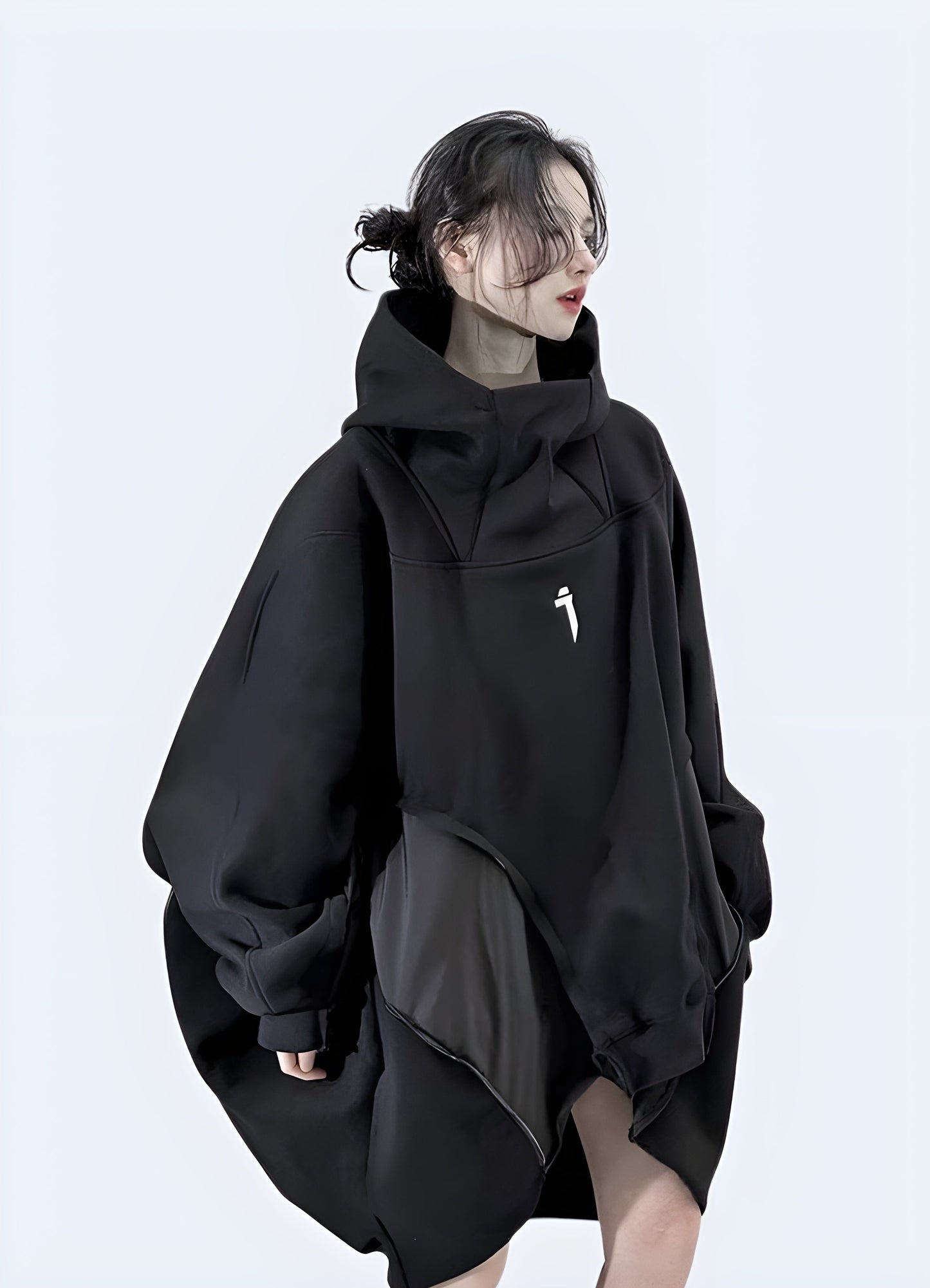 Right side view of a techwear oversized women's hoodie, showcasing its unique fit and design, ideal for the Canada fashion scene.