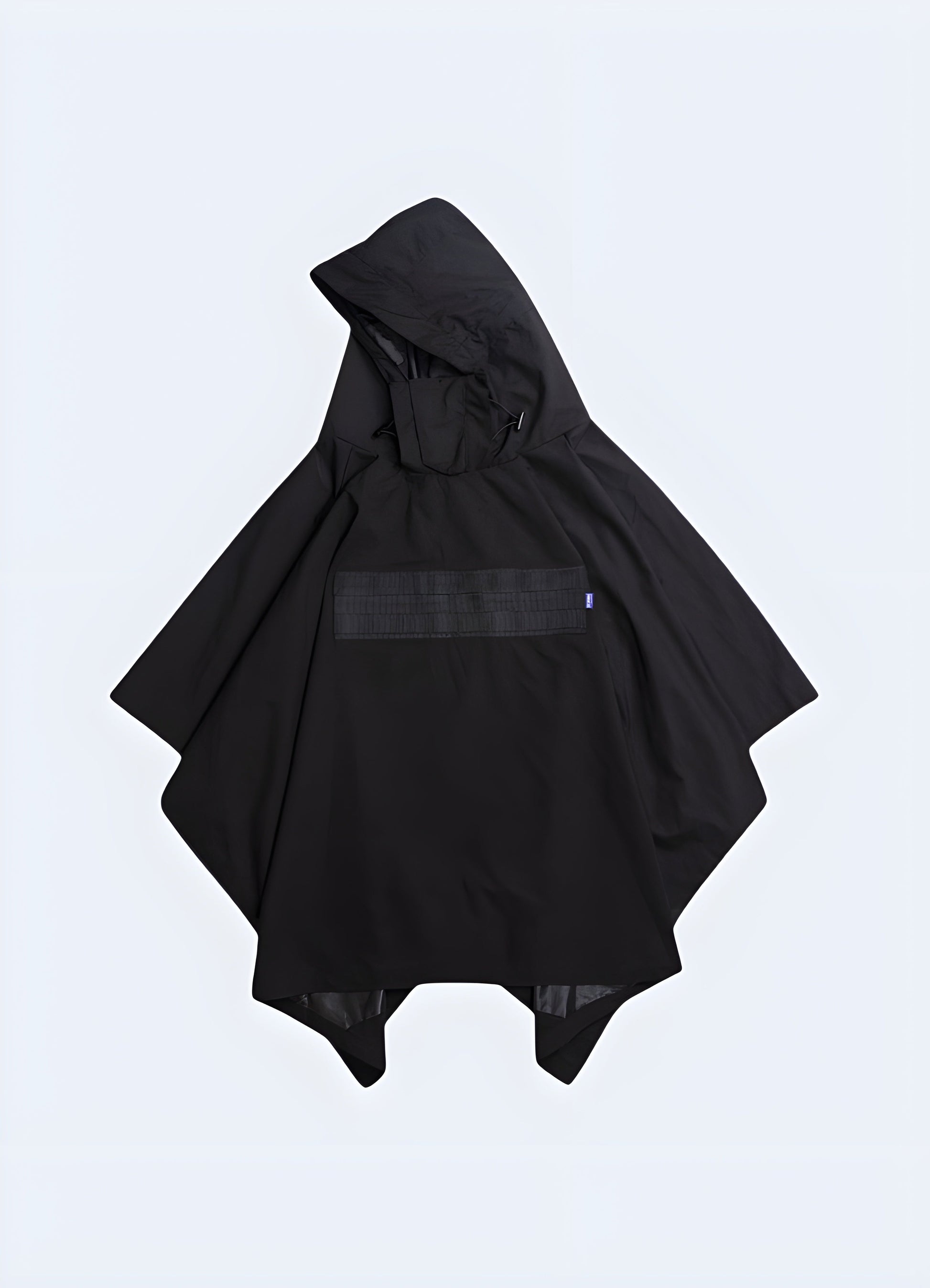 Front view of a techwear poncho, showcasing the sleeFront view of a person wearing a sleek black techwear poncho in a Canadian forest, highlighting the garment's modern design and practicality for outdoor enthusiasts.k design and advanced technical features.