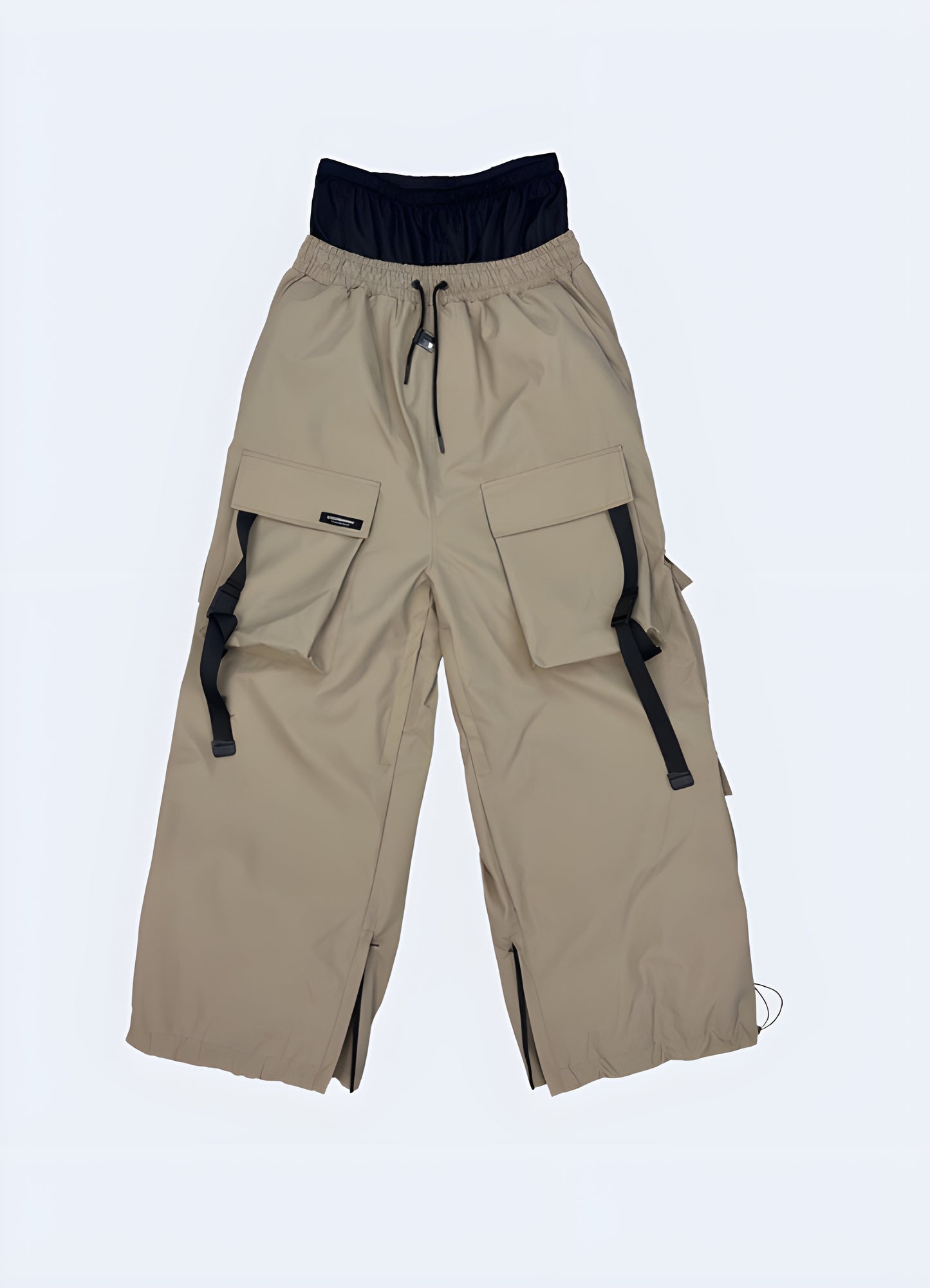 Front view of khaki techwear ski pants, built with advanced materials and functional features for exceptional performance in Canada's challenging ski conditions.