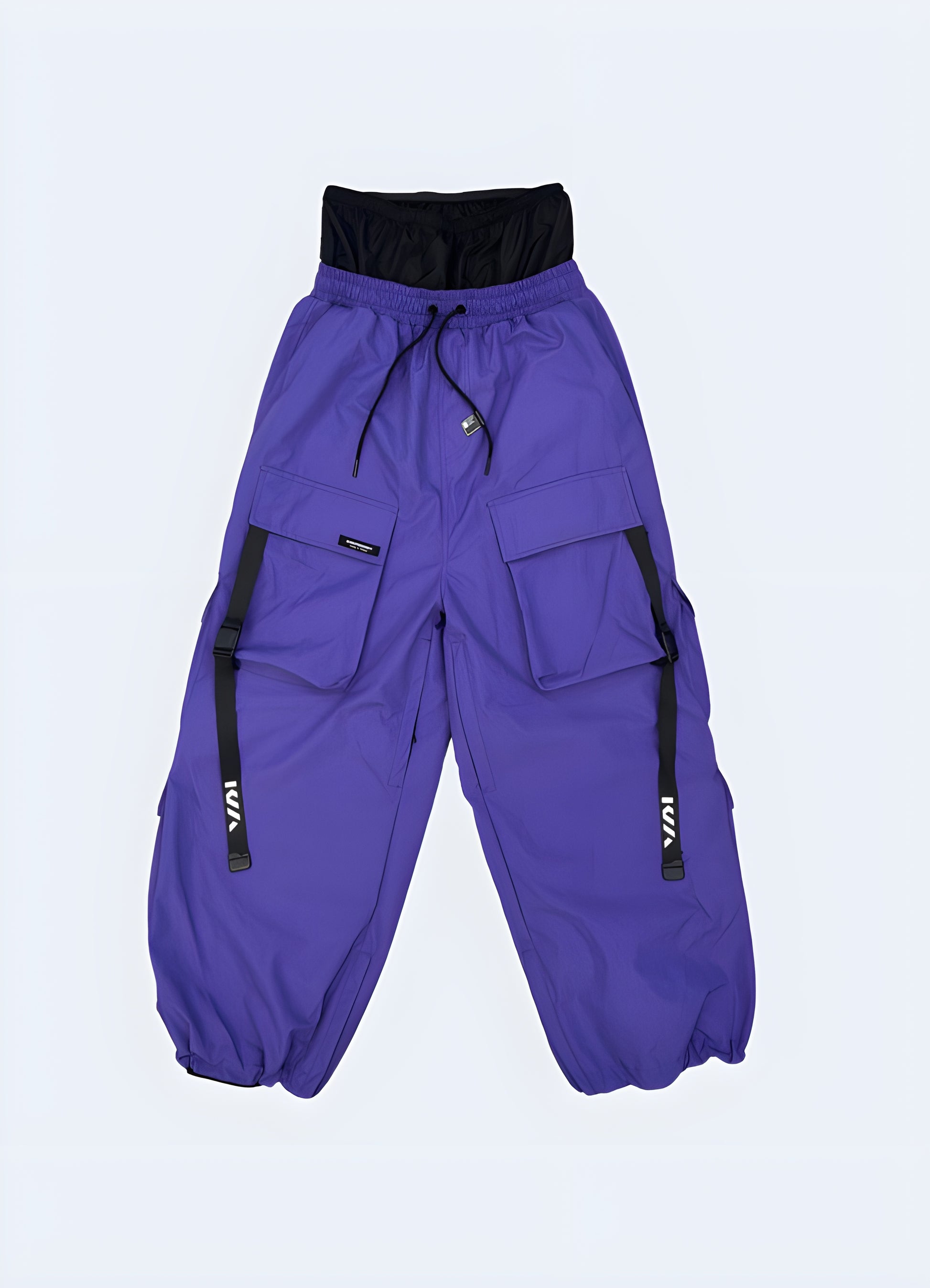 Techwear ski pants in vibrant purple, front view, showcasing their modern and practical features, available in Canada.