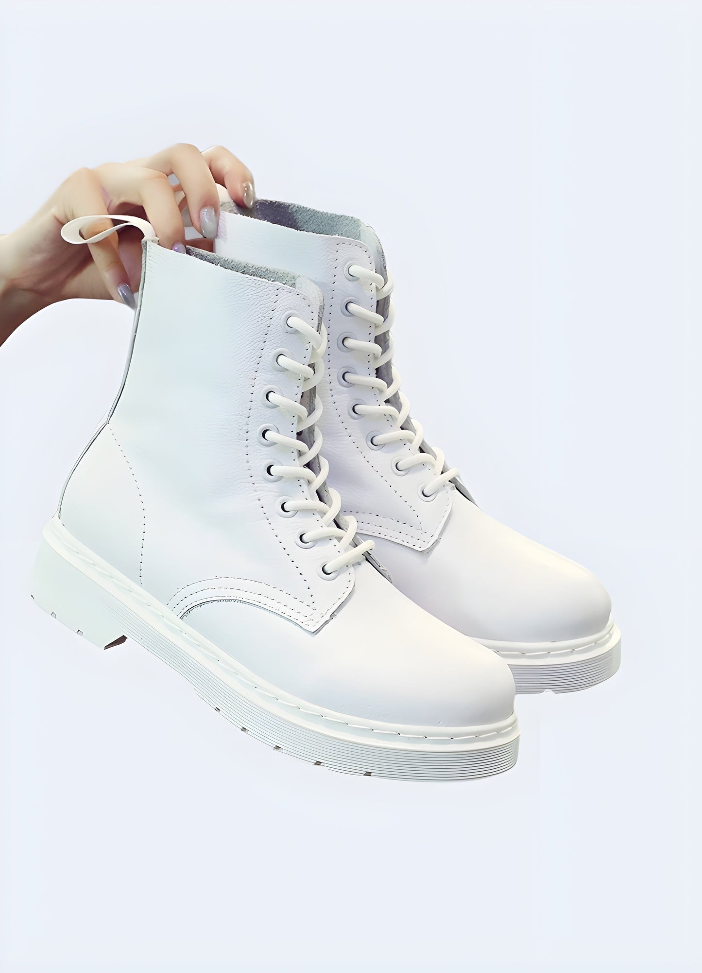 Front and side view of techwear white leather boots, highlighting the sleek silhouette, lace-up closure, and versatile white color suitable for various styles and occasions.